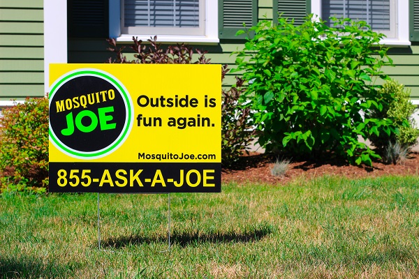 Mosquito Joe Yard Sign is displayed on the front lawn of a Texas residence.