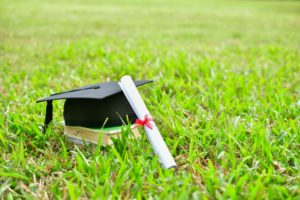 outdoor graduation cap and diploma